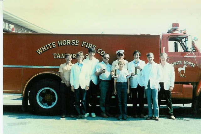 The firemen and ambulance crew displaying the trophies from the Honey Brook Fire Co. Housing Parade in front of Tanker 4-9... July 1986